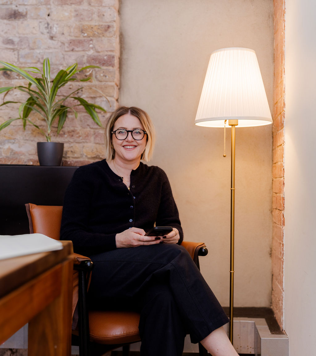 Claire Walker, executive virtual assistant, working on a laptop